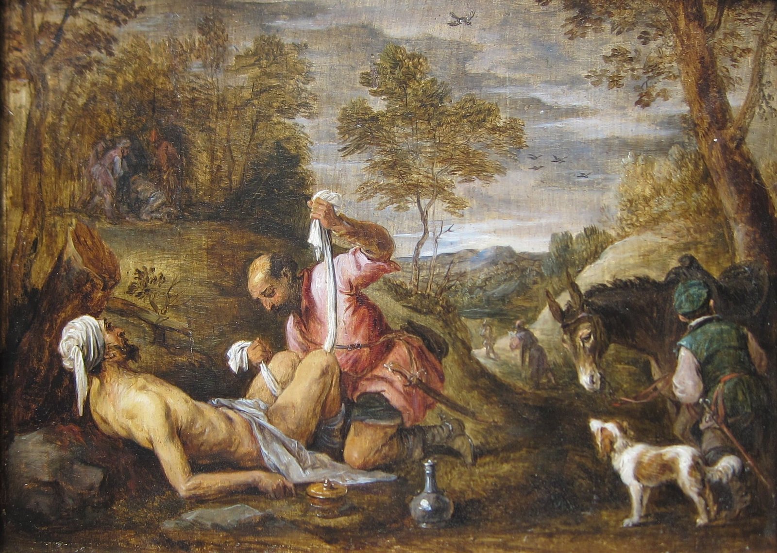 Tableau de David Teniers le Jeune : un Samaritain soigne un voyageur blessé, allongé près d’un arbre ; un âne se tient à droite dans le paysage.